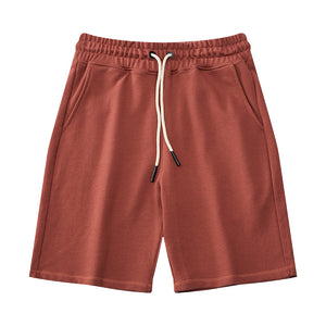 Men's heavy cotton mid-waist shorts in various colors including black, red, and blue