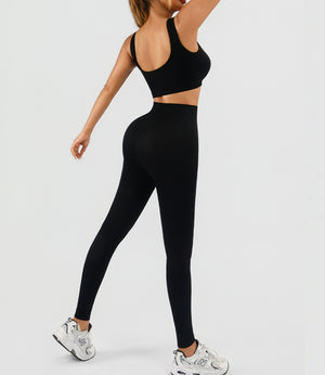 Seamless women's workout set with ribbed tank and high waist yoga shorts in multiple colors