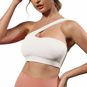 One-shoulder bare-feel sports bra in various colors with medium cup and halter neck straps