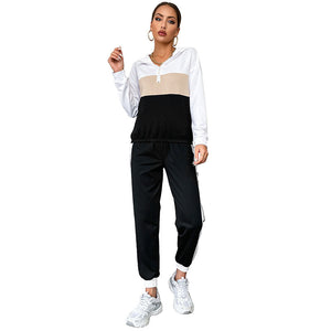 Black women's sporty hoodie and pants two-piece set with contrast color design