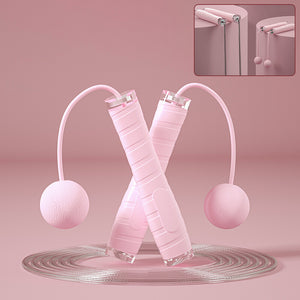 Dual purpose skipping rope with cordless ball in pink, black, and blue colors