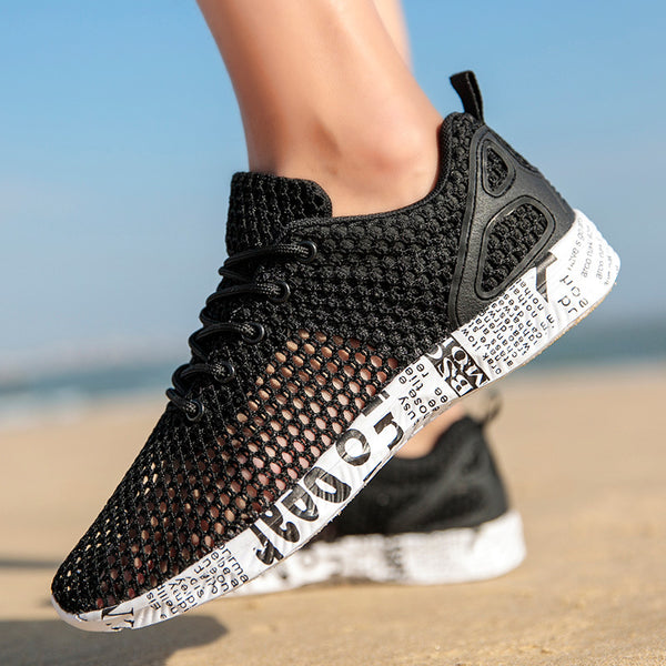 Breathable mesh men's casual sneakers in black, grey, and dark green