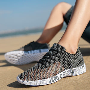 Breathable mesh men's casual sneakers in black, grey, and dark green