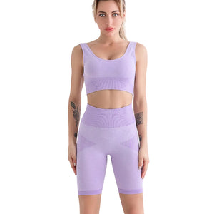 Sports bra and shorts workout set in gray, blue, and purple colors