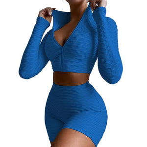 Women's yoga workout set with long sleeve zipper top and high waist shorts in multiple colors