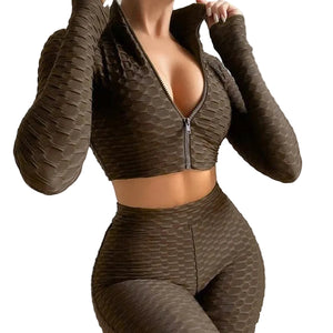 Women's yoga workout set with long sleeve zipper top and high waist shorts in multiple colors
