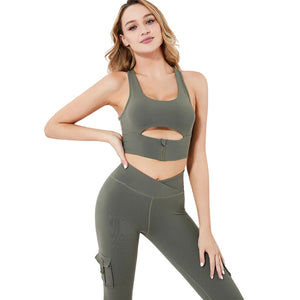 Women's padded yoga bra with zipper and high waist leggings with cargo pockets in multiple colors