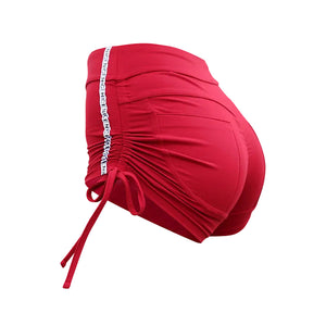 Women's moisture-wicking sports shorts in black, red, and grey with lace-up hips