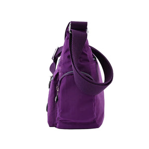 Waterproof nylon women's crossbody shoulder bag in various colors with multiple pockets