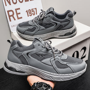 Men's breathable mesh athletic dad shoes in black and gray with thick rubber sole