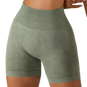 Women's breathable hip-lifting fitness shorts in light coffee, modern grey, and wild green colors