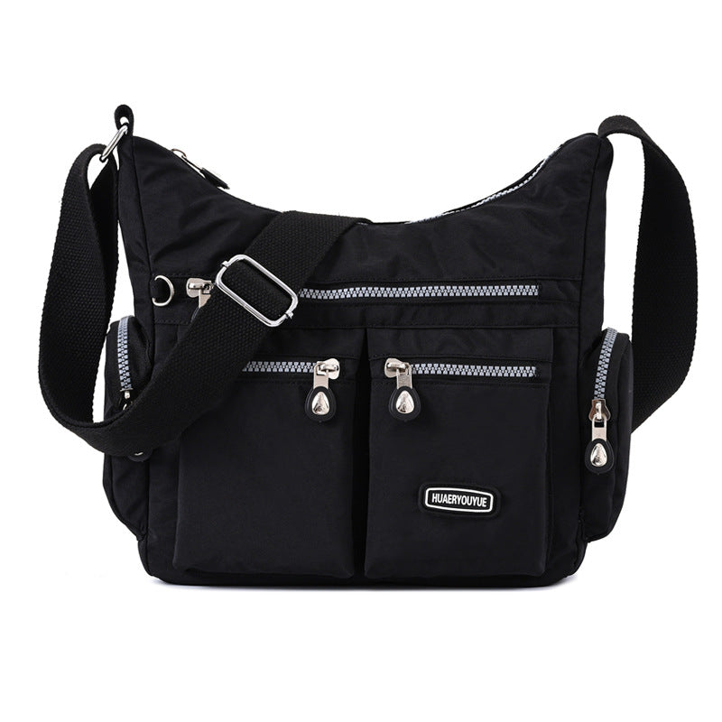 Waterproof nylon women's crossbody shoulder bag in various colors with multiple pockets