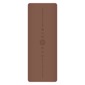 White PU leather yoga mat with natural rubber base rolled out on floor