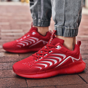 Glow-in-the-dark men's trainers in green, black, white, and red with mesh vamp and TPU sole