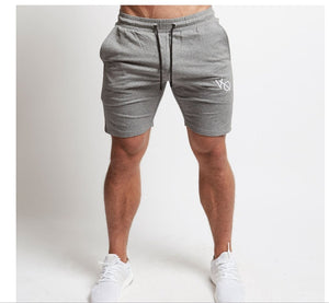Men's cotton athletic five-point shorts in black, gray, and khaki colors