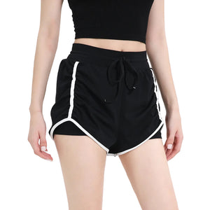 Women's three-quarter length sports shorts in black, milk white, and grass green