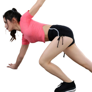 Women's moisture-wicking sports shorts in black, red, and grey with lace-up hips