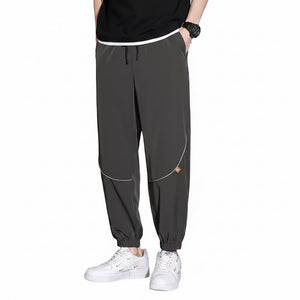 Men's tapered casual pants in gray, black, and army green colors
