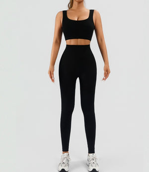Seamless women's workout set with ribbed tank and high waist yoga shorts in multiple colors
