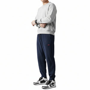 Men's elastic anti-wrinkle casual pants in tapered fit shown from multiple angles