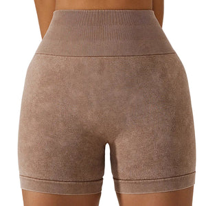Women's breathable hip-lifting fitness shorts in light coffee, modern grey, and wild green colors