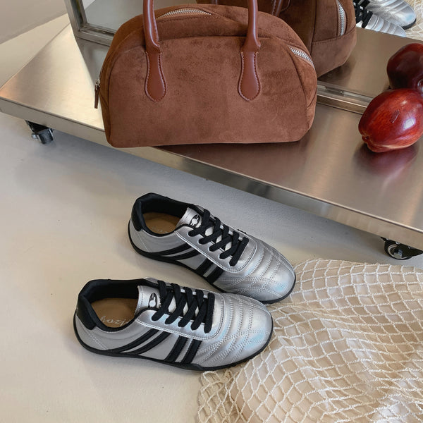 Women's versatile lightweight training sneakers in black, silver, and beige with lace-up closure