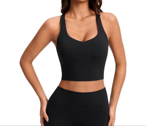 Women's push-up sports bra with breast pads in pink, white, and black colors