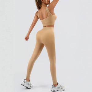 Seamless women's workout set with ribbed tank and high waist yoga shorts in multiple colors