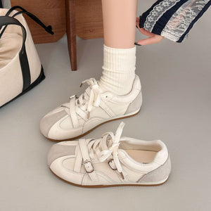 Women's retro high rise thick soled training shoes in red and beige with lace-up closure