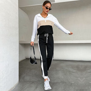 Black women's sporty hoodie and pants two-piece set with contrast color design
