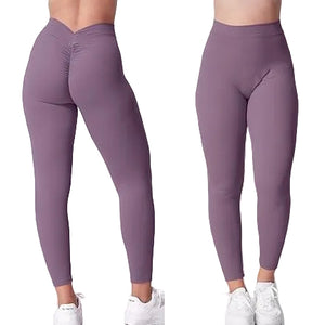 High waist hip lift sports leggings in black with side pockets and cropped fit