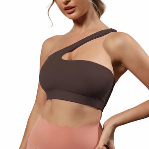 One-shoulder bare-feel sports bra in various colors with medium cup and halter neck straps