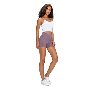 Women's high waisted athletic fitness shorts with two side pockets in various colors