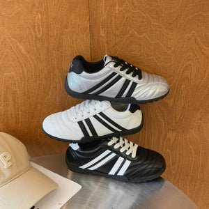 Women's versatile lightweight training sneakers in black, silver, and beige with lace-up closure