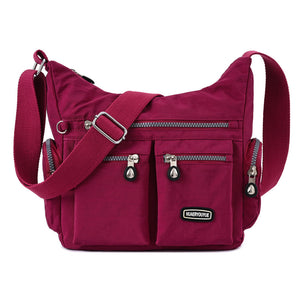 Waterproof nylon women's crossbody shoulder bag in various colors with multiple pockets