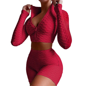 Women's yoga workout set with long sleeve zipper top and high waist shorts in multiple colors