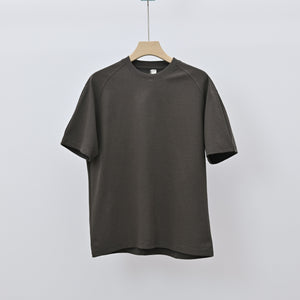 Men's loose-fit patchwork t-shirt in assorted colors with short sleeves and appliqué detailing