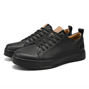 Men's casual leather sneakers in white and black with rubber sole and front lacing