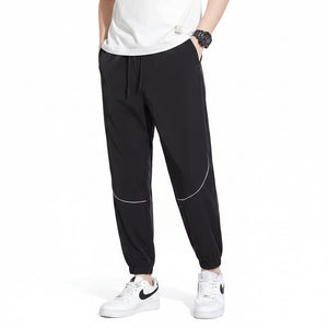 Men's tapered casual pants in gray, black, and army green colors