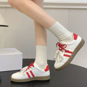 Women's casual leather running sneakers in multiple colors with rubber sole and lace-up closure