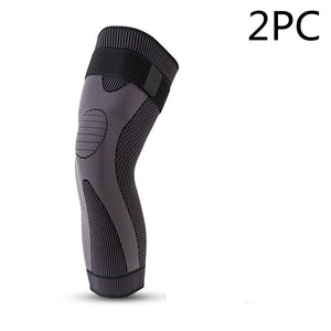 Long straps knee pads in green and black colors showing non-slip sports protection design