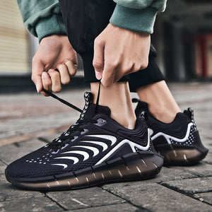 Glow-in-the-dark men's trainers in green, black, white, and red with mesh vamp and TPU sole