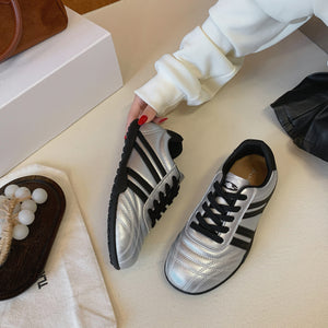 Women's versatile lightweight training sneakers in black, silver, and beige with lace-up closure