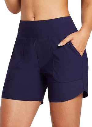 Women's quick dry athletic shorts in black and navy blue shown in various active and casual settings