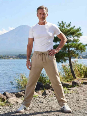 Men's stretch anti-wrinkle casual pants in black shown from multiple angles