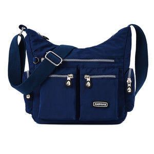 Waterproof nylon women's crossbody shoulder bag in various colors with multiple pockets