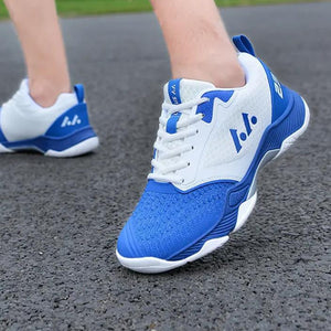 Men's mesh volleyball training shoes in white with blue, red, and black accents