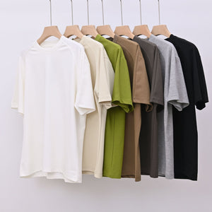 Men's loose-fit patchwork t-shirt in assorted colors with short sleeves and appliqué detailing