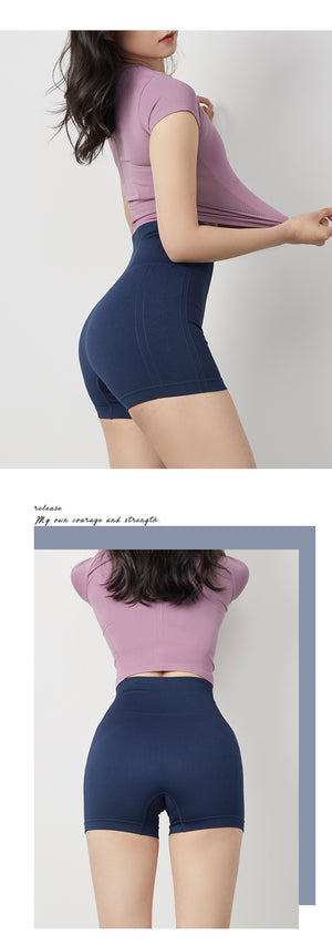 Women's tight fitting fitness yoga shorts in army green, sand pink, twilight blue, and mysterious black