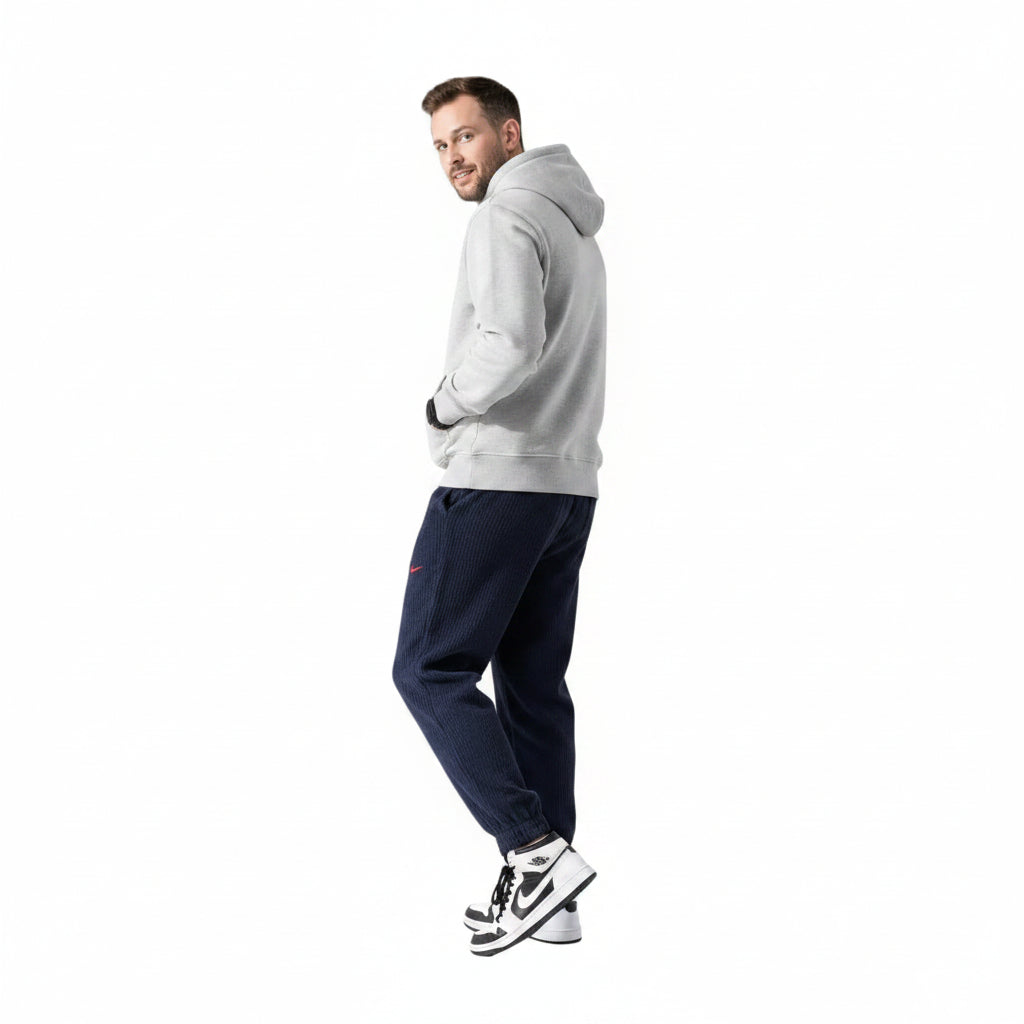 Men's elastic anti-wrinkle casual pants in tapered fit shown from multiple angles